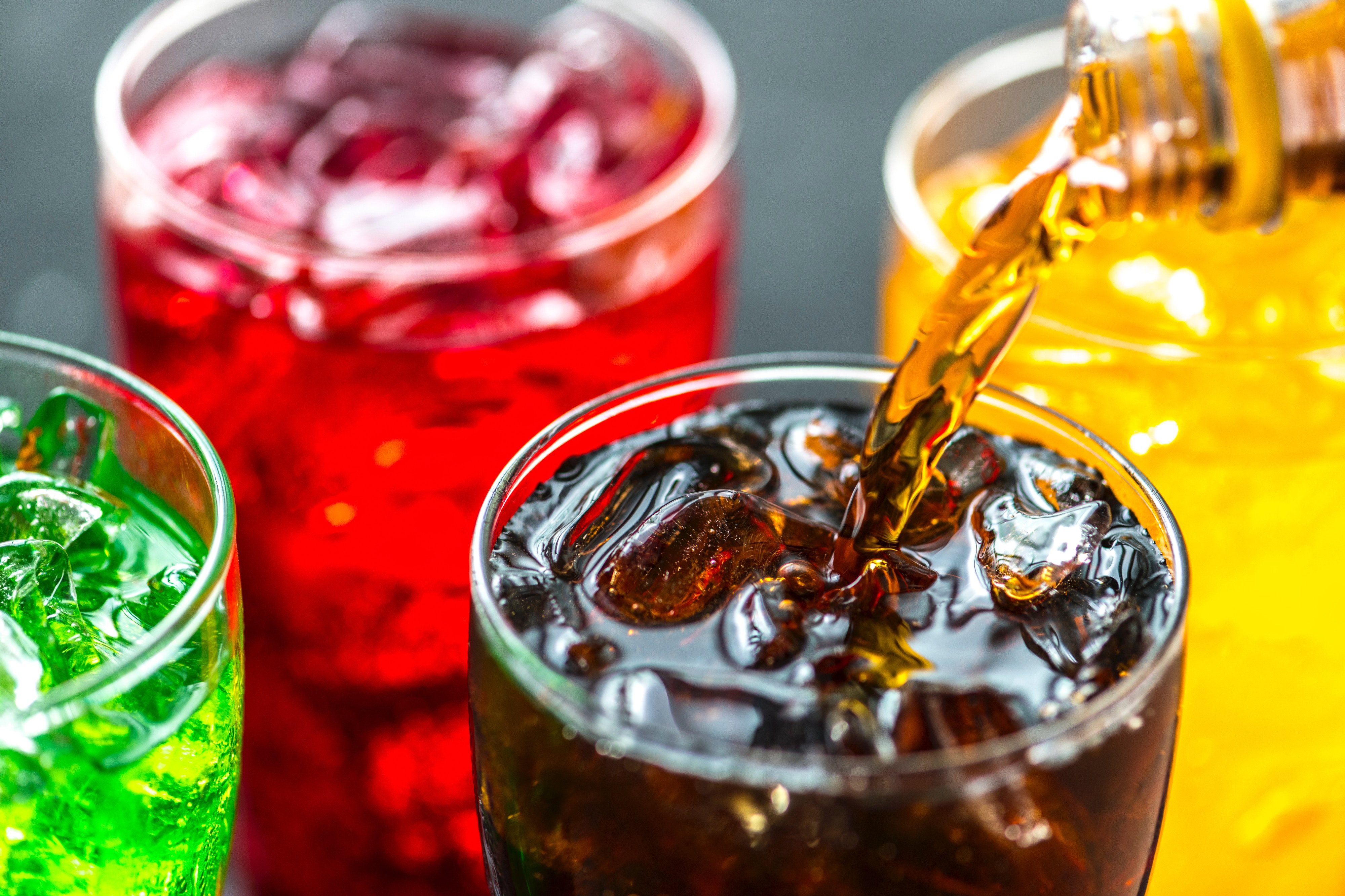 CBD infused soft drinks being poured into glasses