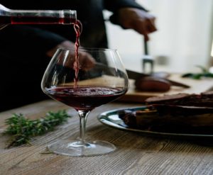 Pouring wine into a wine glass